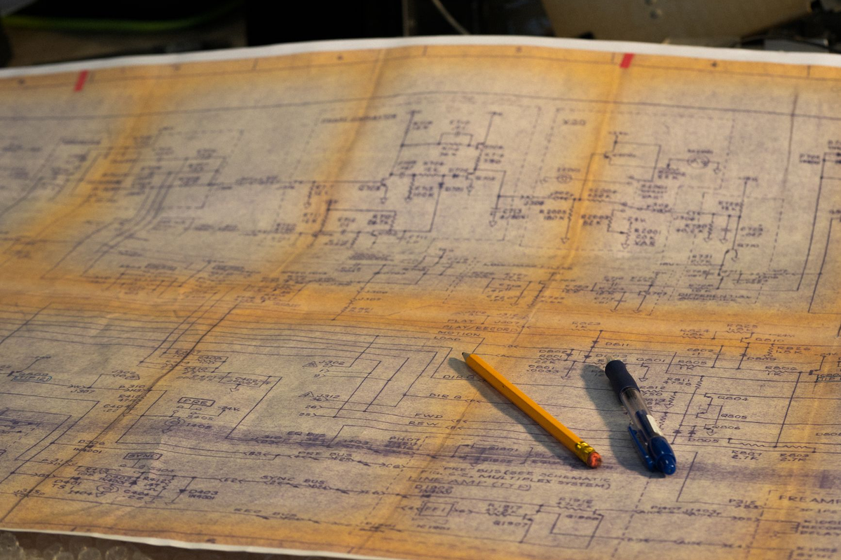 A planning desk at the Deal The Night studio with floor plans and sample event chips