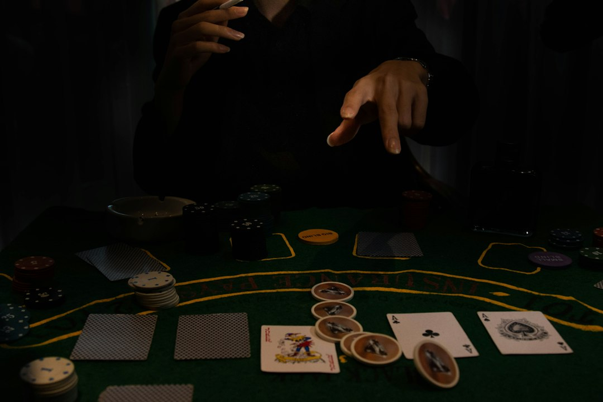 An intimate salon with a single premium casino-themed table under discreet low lighting